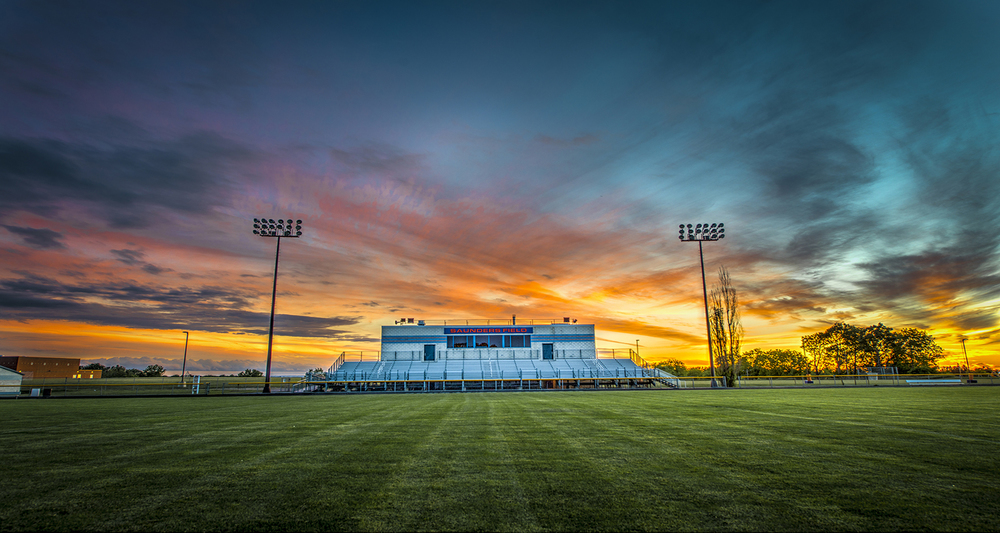 football field with sunset