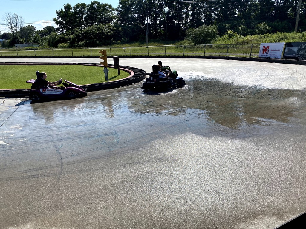 go karts showing hydroplaning