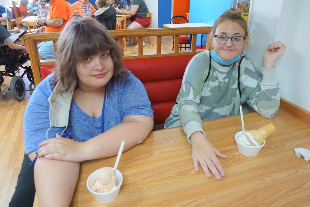 two students smiling with ice cream treats