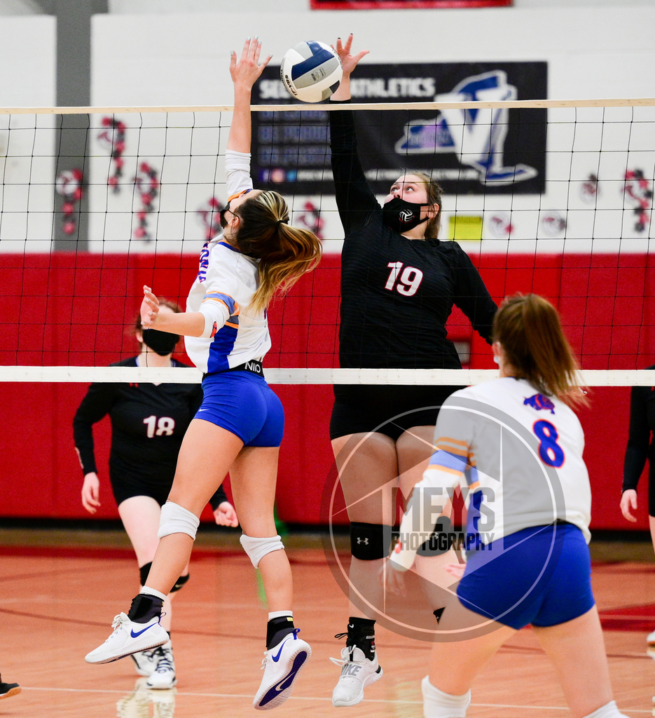 athletes playing volleyball