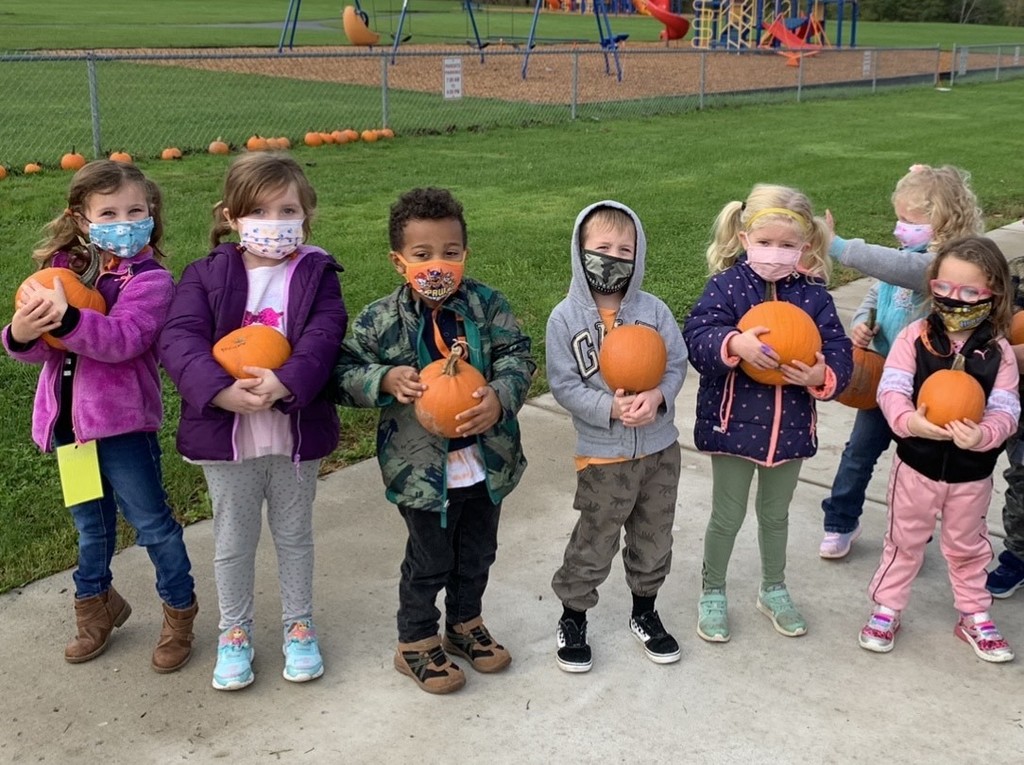 students with pumpkins