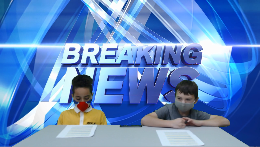 two students at news desk with the words breaking news on green screen