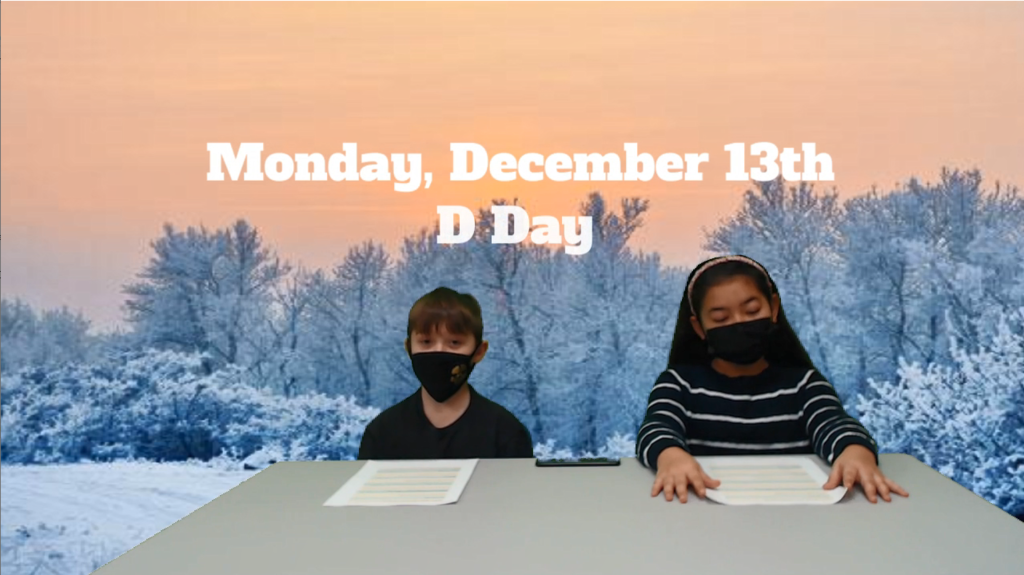 two students at desk with snow scene on green screen