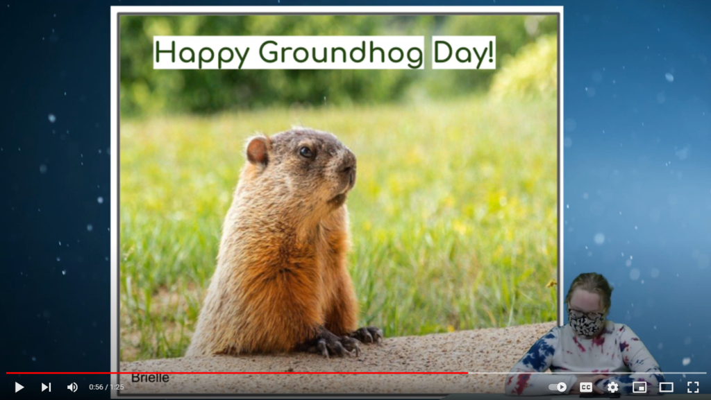 student at desk with groundhog on green screen