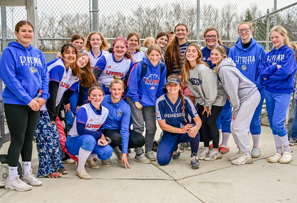livonia students standing around college player