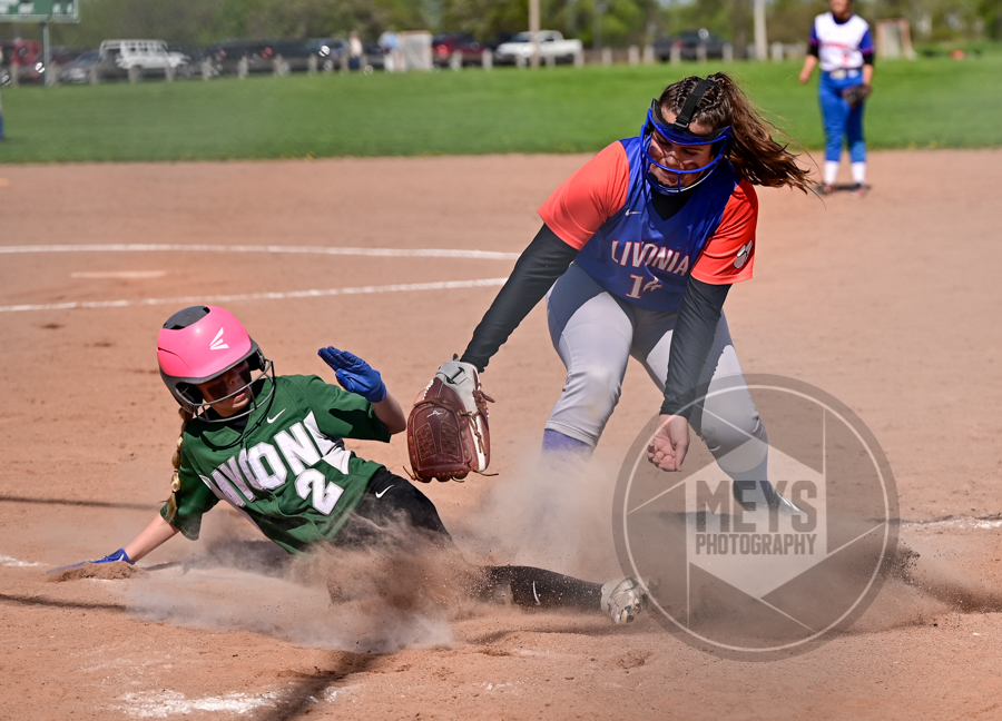 softball player tagging out on base