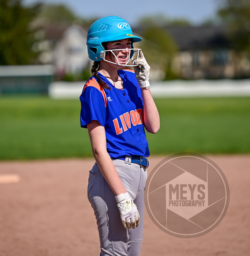 softball player smiling with helmet on