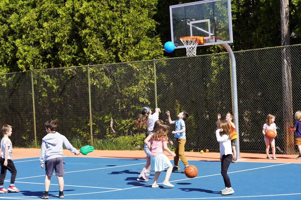 students playing basketball and tag