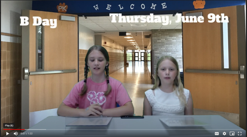 two students at news desk with school hallway on green screen