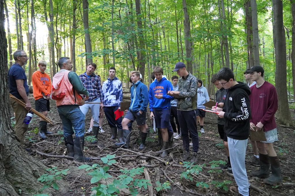 class in woods with DEC Forester