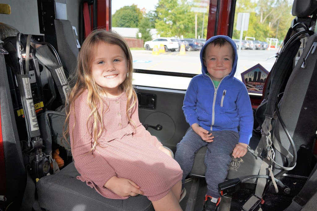 two students in fire truck