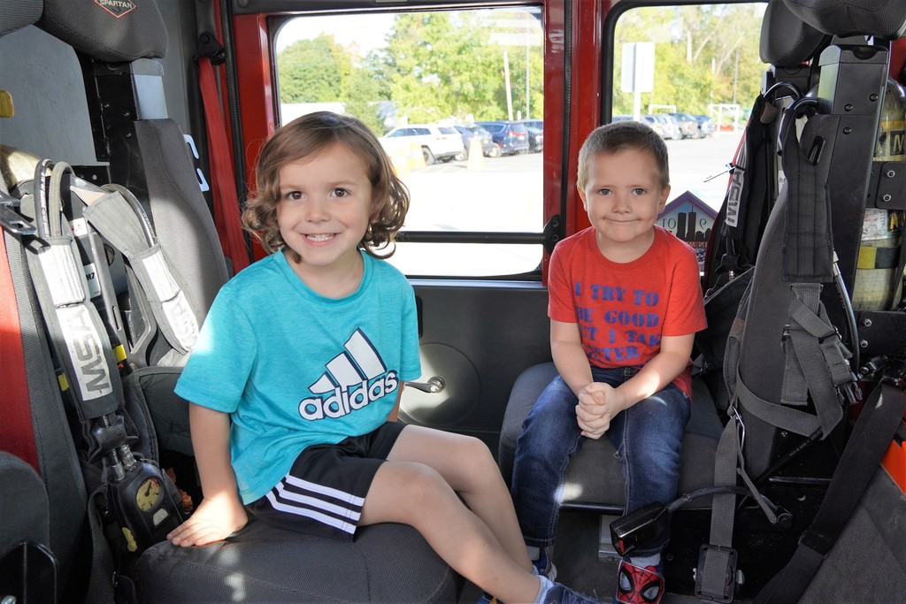 two students in fire truck