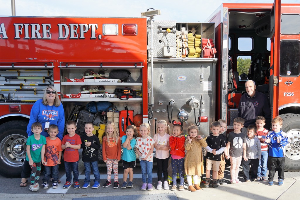 students in front of firetruck