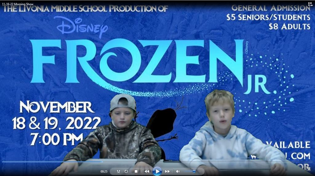two students at news desk with Frozen backdrop