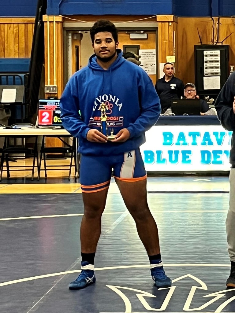 student holding trophy