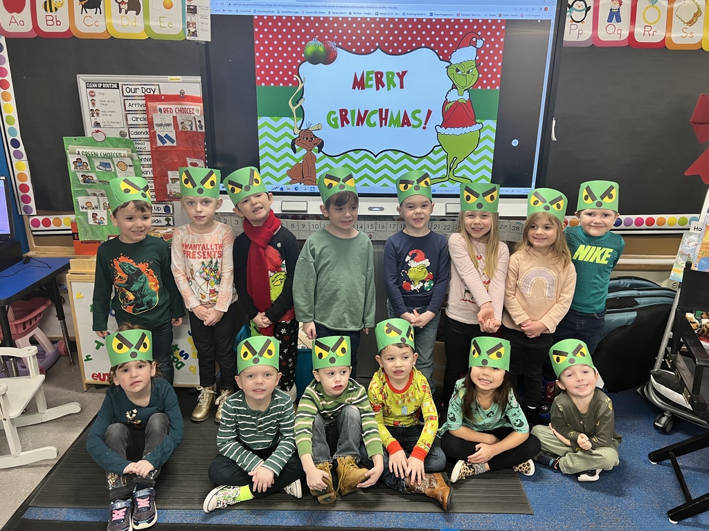 students wearing grinch hats