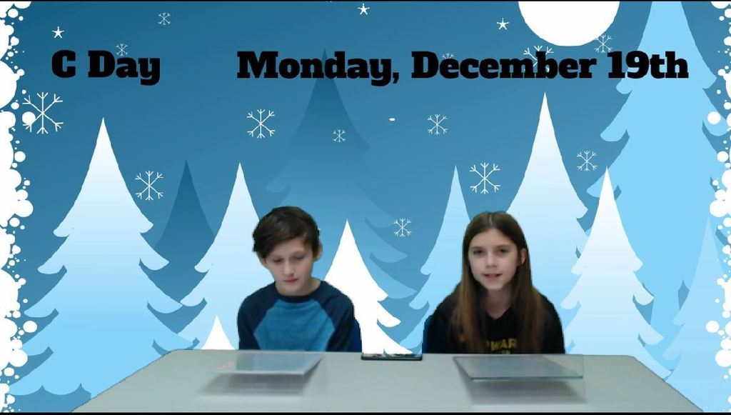 two students at news desk with graphic of snowy trees on green screen