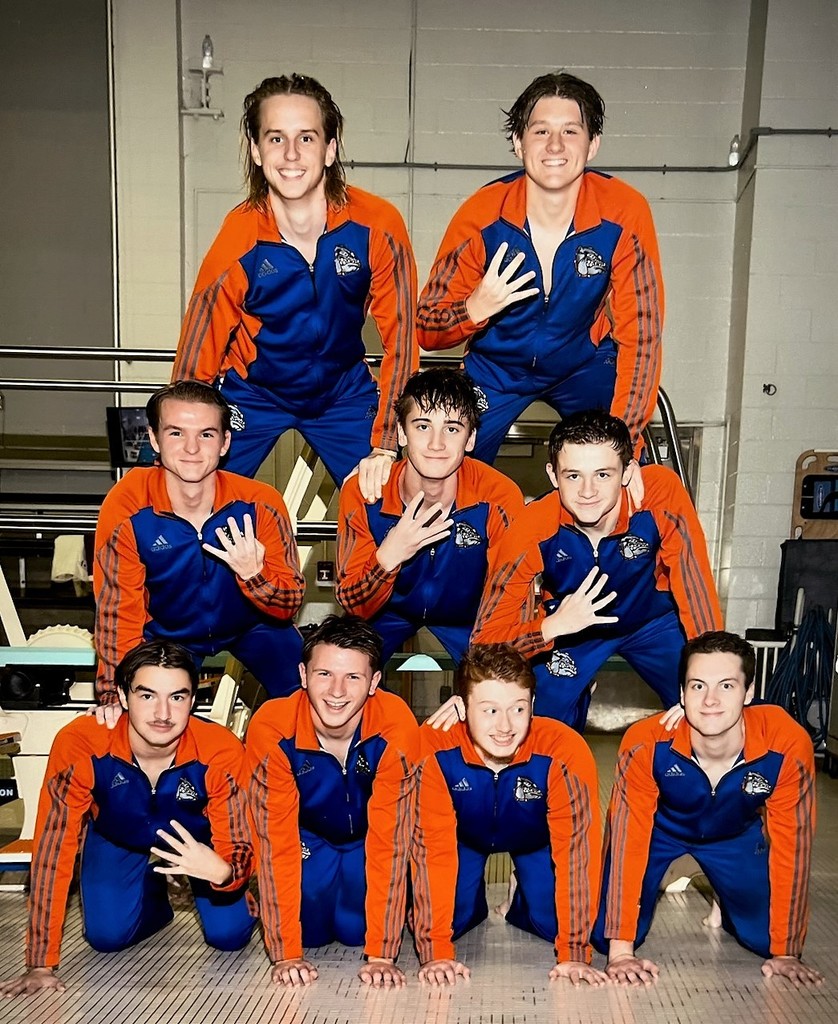 9 swimmers in a pyramid formation