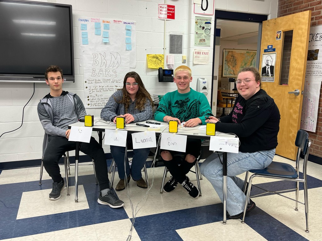 4 students ready for trivia competition