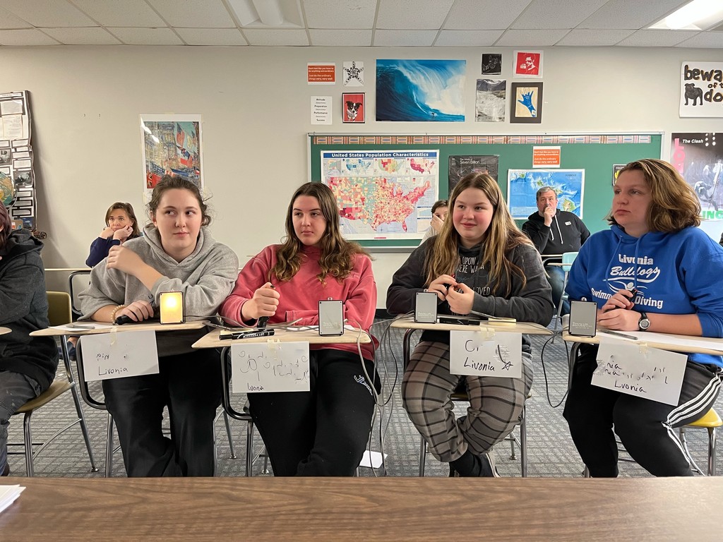 4 students ready for trivia competition