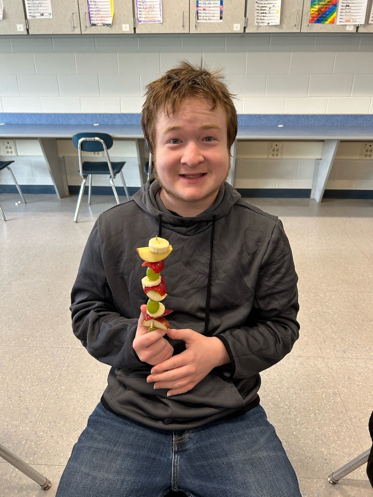 student with fruit kabab