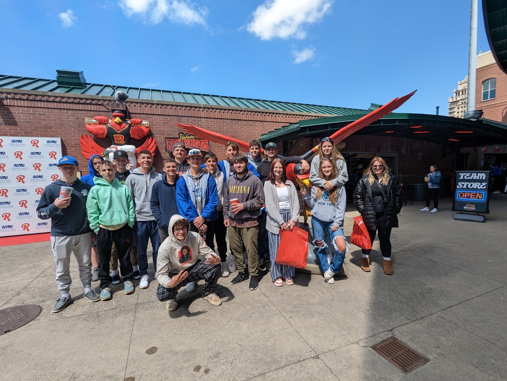 students in front of red wings stadium