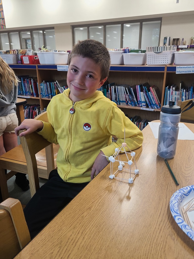 students building the Eiffel Tower with marshmallows and toothpicks